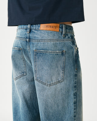 BAGGY MID-WASHED DENIM TROUSERS